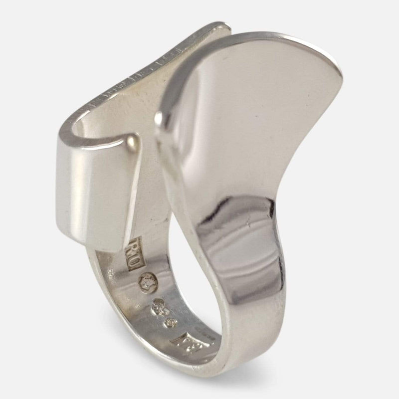 The silver abstract ring viewed upright at an angle