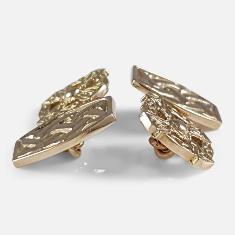 a side on view of the pair of cufflinks
