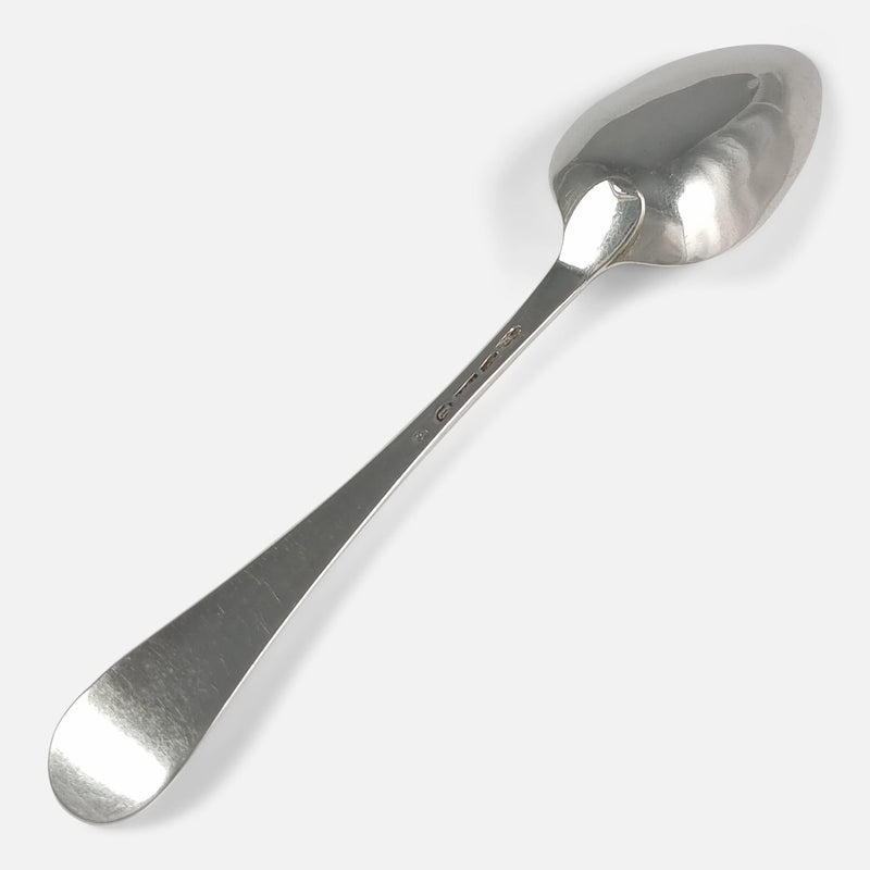 one of the spoons face down and viewed diagonally