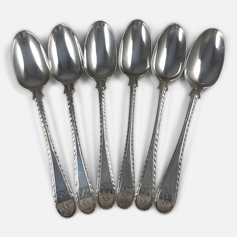 6 of the teaspoons in a fanned out formation