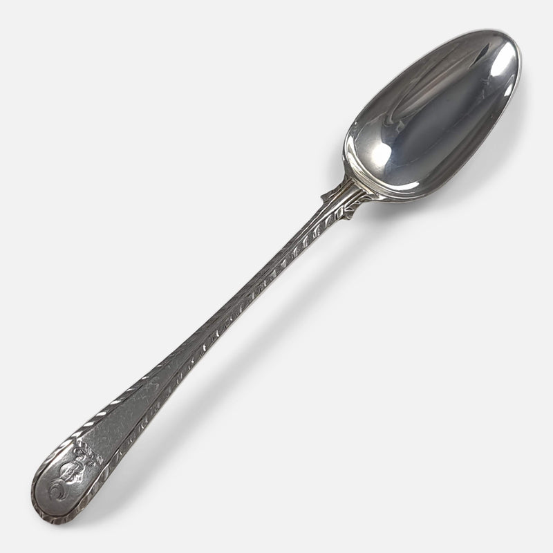 one of the teaspoons viewed diagonally with the bowl facing towards the upper right corner