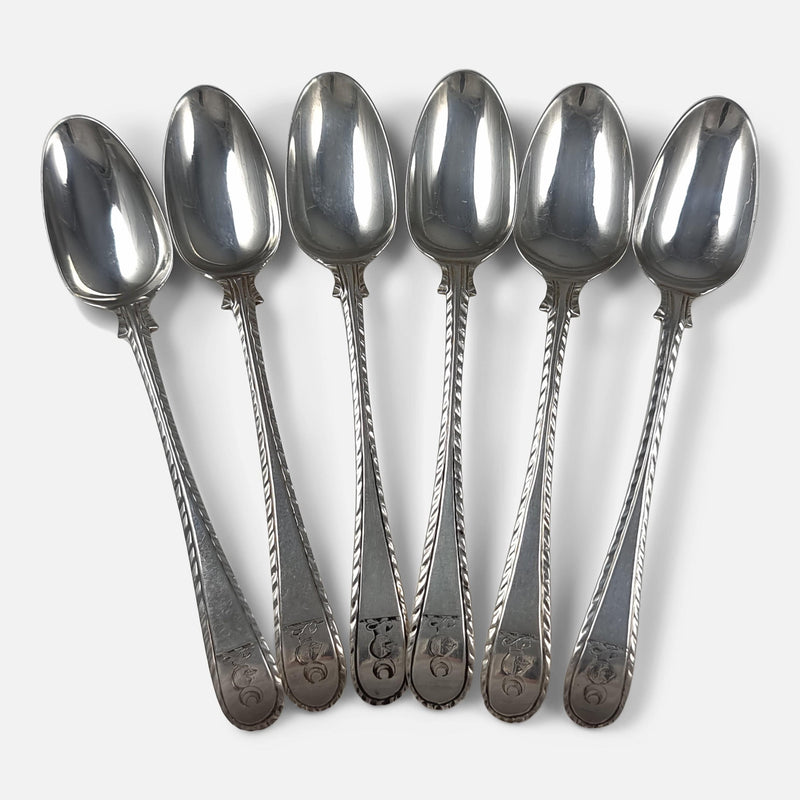 6 of the teaspoons in a fanned out formation