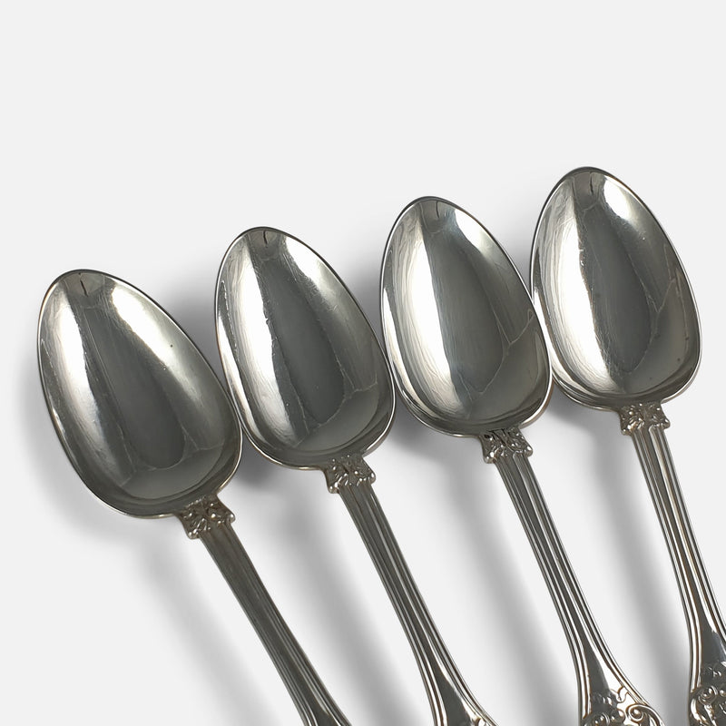 focused on 4 of the bowls of the silver spoons