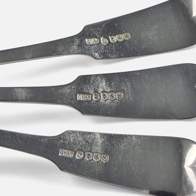 the back of the three ladles with hallmarks in focus