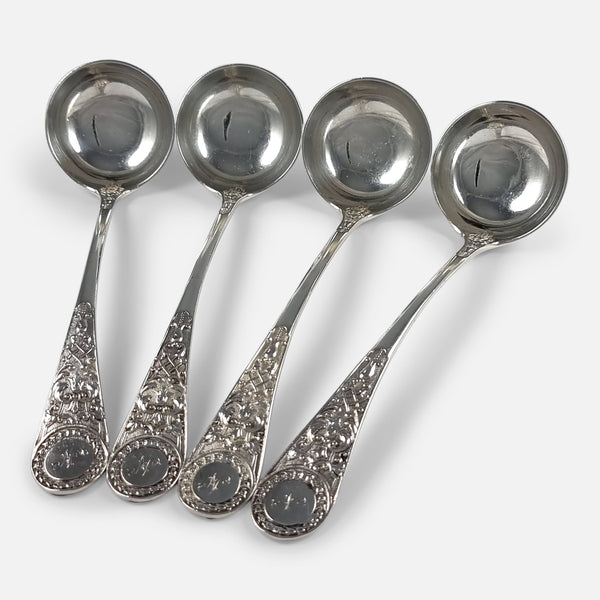 the 4 Victorian sterling silver ladles viewed at a slight angle