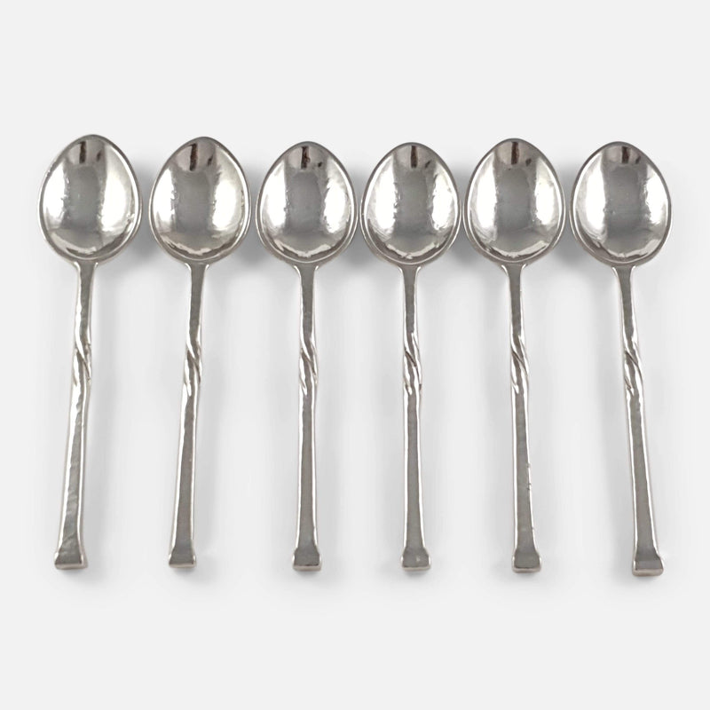 the set of 6 Arts and Crafts sterling silver coffee spoons viewed from above