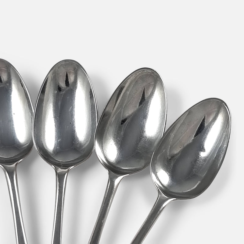 focused on three of the spoons to include bowls