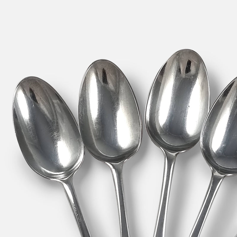 focused on three of the spoons to include bowls