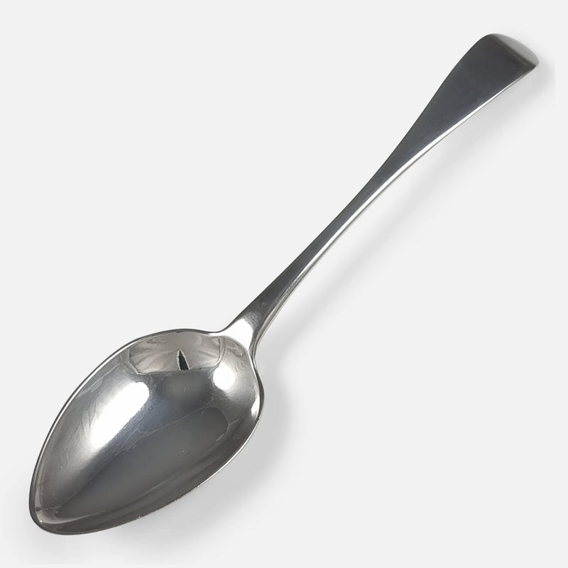 one of the spoons viewed diagonally with bowl facing to bottom left corner of image