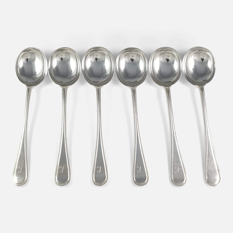 the silver beaded pattern soup spoons viewed from above