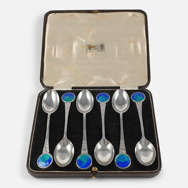 the silver and enamel teaspoons viewed in the case