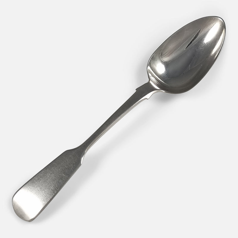 one of the teaspoons viewed diagonally with handle to foreground
