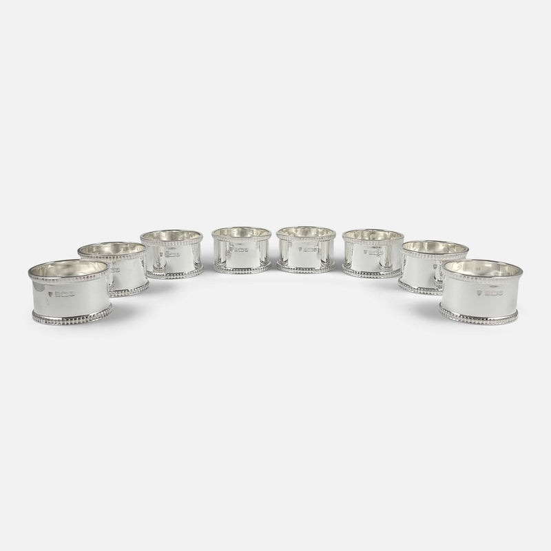 the napkin rings laid out in a horse shoe shape