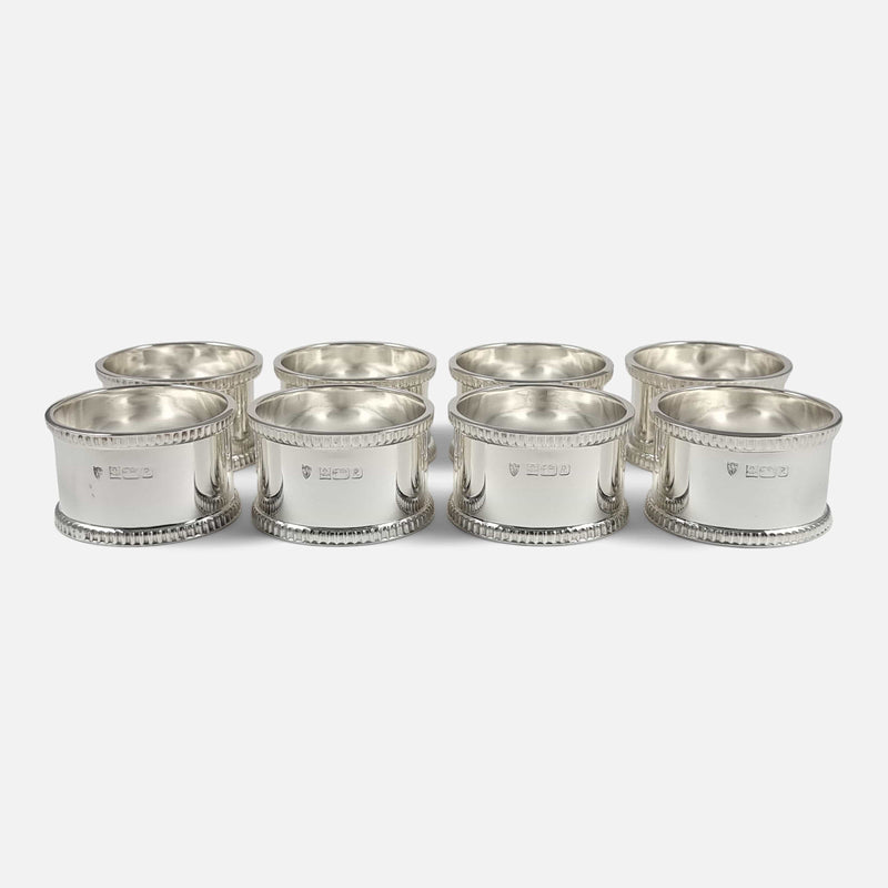 the napkin rings set out in rows of two
