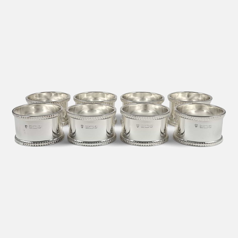 the napkin rings set out in rows of two