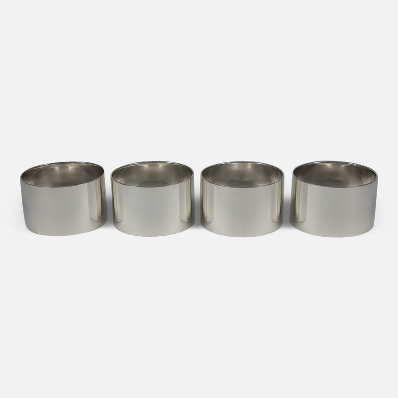 the napkin rings in a row with hallmarks to the back