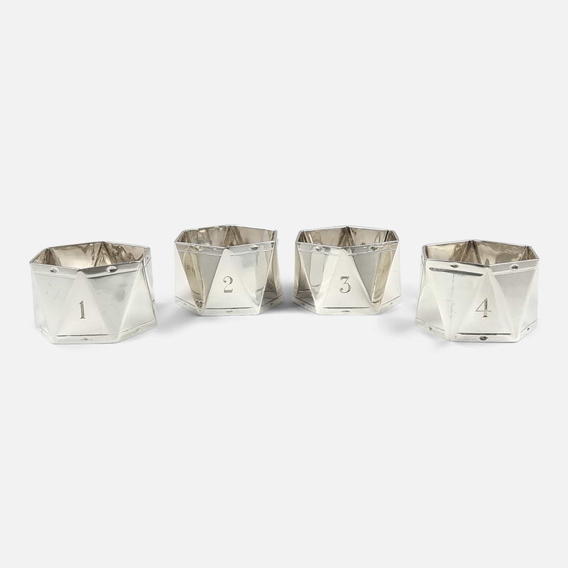the four numbered napkin rings viewed out of their box