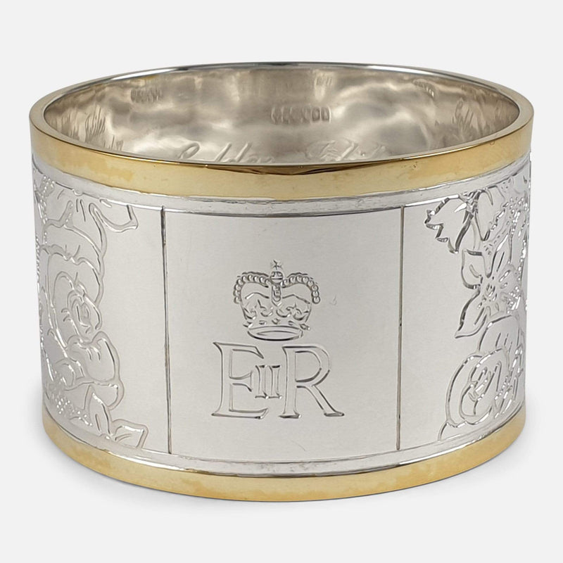 focused on the Royal cypher to the front of one of the napkin rings