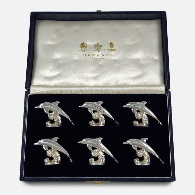 The Set of Six Sterling Silver Menu Place Card Holders by Garrard & Co, viewed in their case