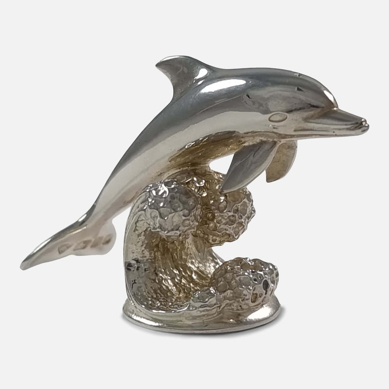 on of the menu holders viewed side on with dolphin facing to the left side
