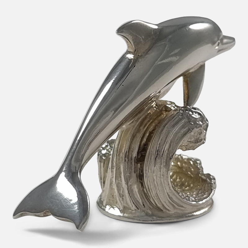 one of the menu holders with dolphin facing into the right hand top corner of image