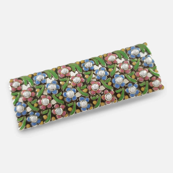 the enamel brooch viewed at a slight angle
