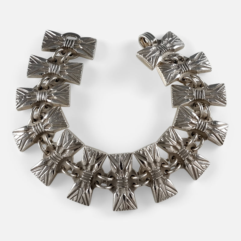 the Hans Hansen silver bracelet laid flat in a horseshoe shape