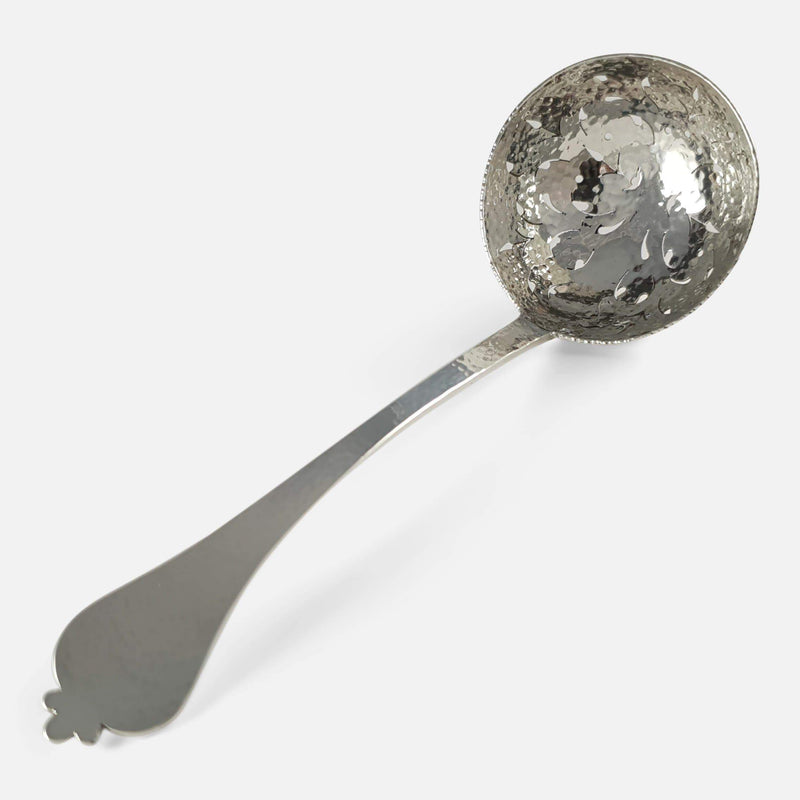 viewed along the length of the Silver Sugar Sifting Spoon by Wakely & Wheeler