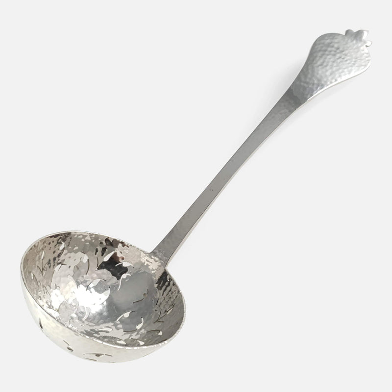 the length of the spoon with the bowl to the forefront