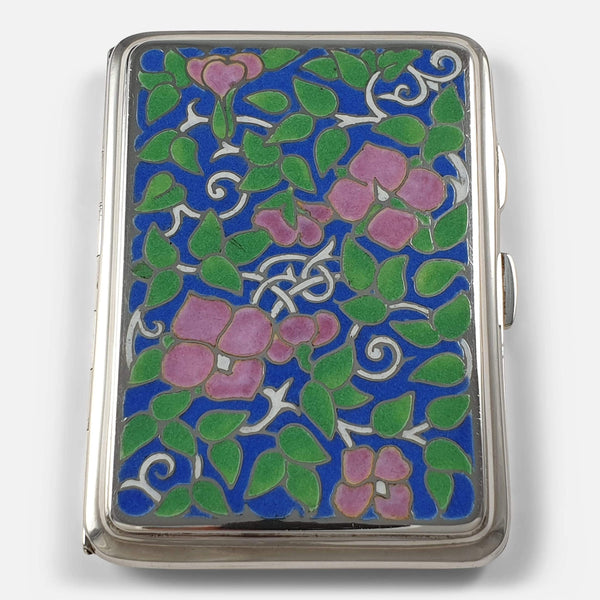 The vintage silver cigarette case; focusing on the enamel frontage