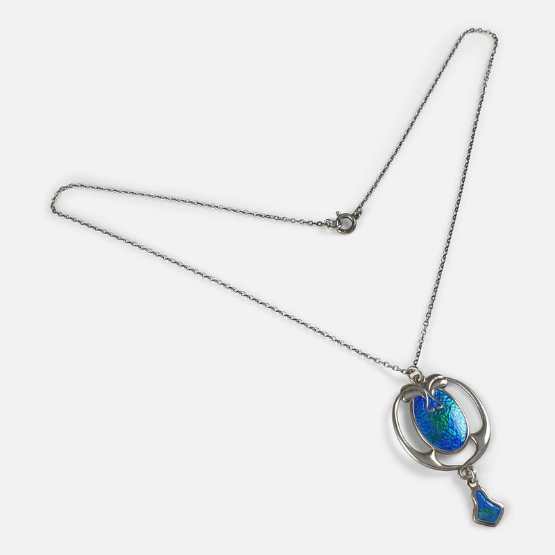 the silver pendant and chain viewed diagonally