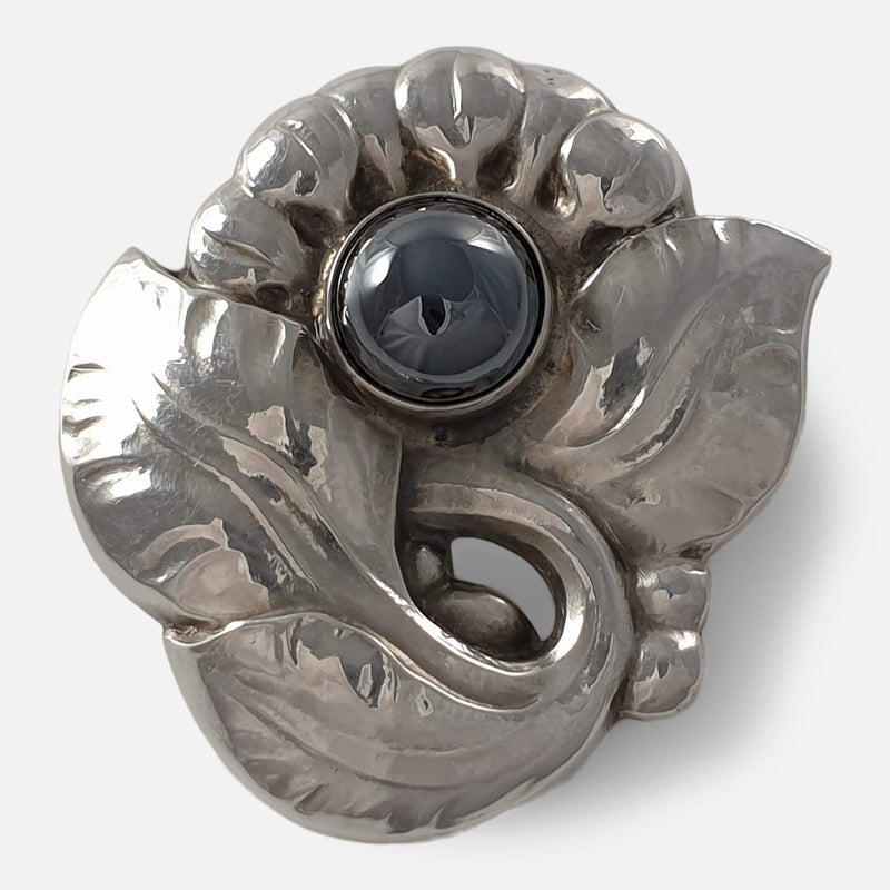 the silver brooch viewed from the front