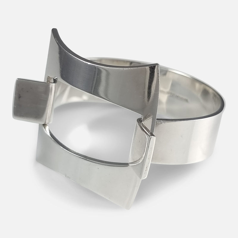 the Danish sterling silver bangle by Hans Hansen, viewed from the right at a slight angle