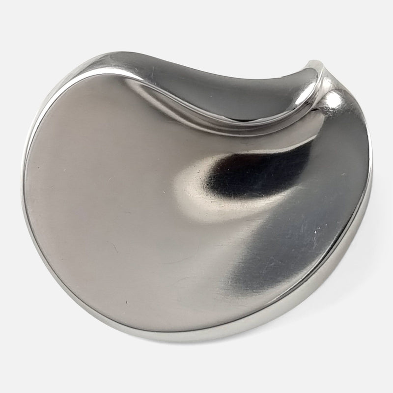 a birds eye view of the silver brooch