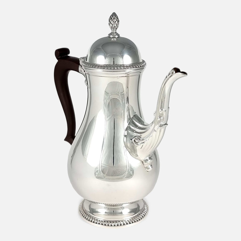 the coffee pot angled with spout to the forefront and pointing slightly towards the right