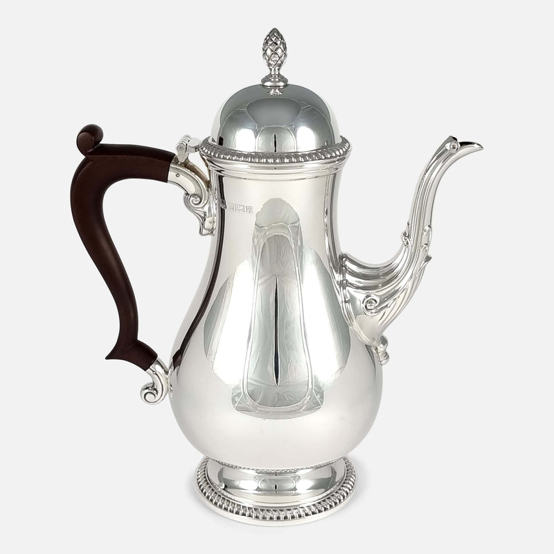 a side on view of the coffee pot with the handle facing left
