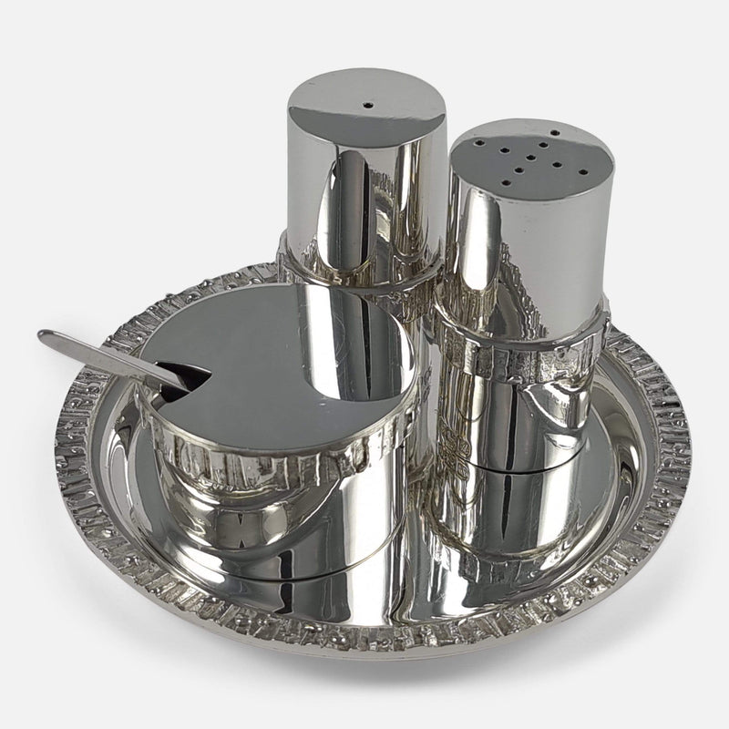 The Brian Asquith sterling silver condiment set viewed sitting on the tray