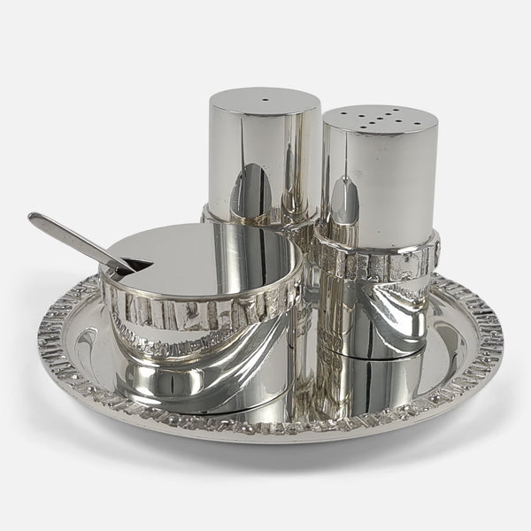 the silver condiment set viewed on the associated tray