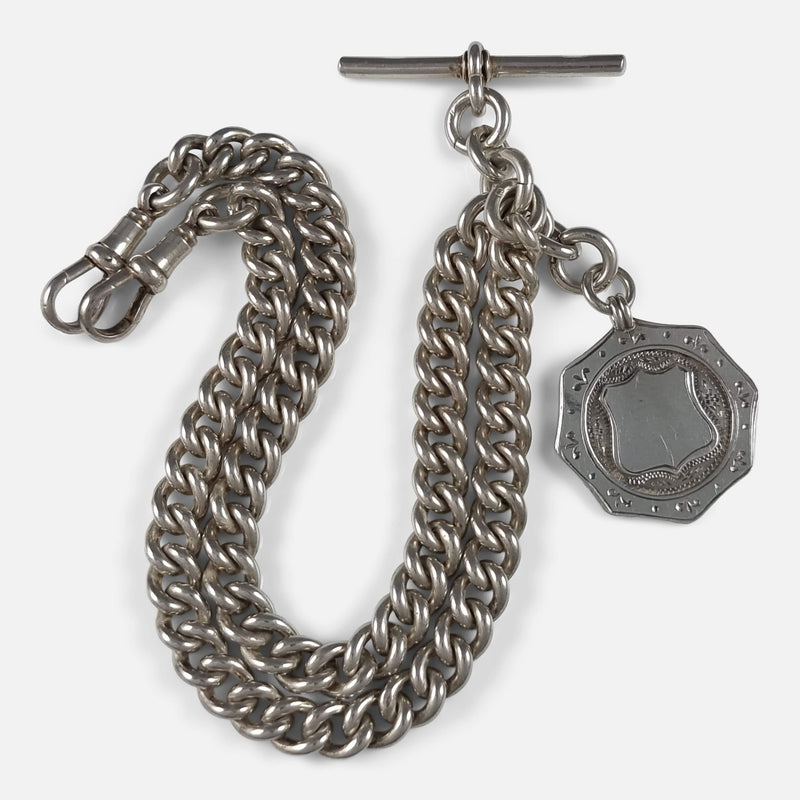 a birds eye view of the silver watch chain and fob