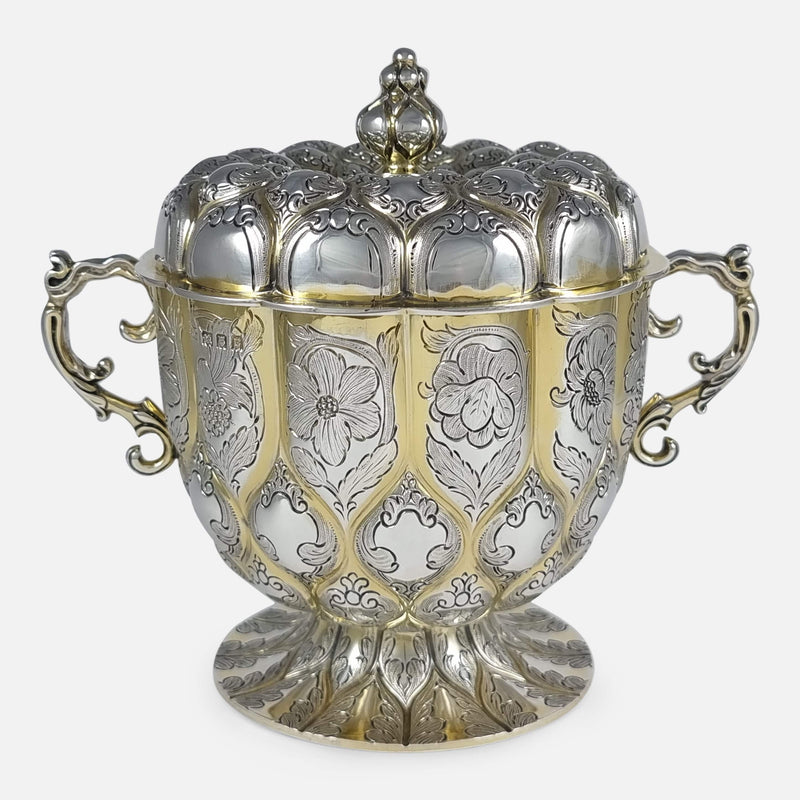 the cup viewed from the front with hallmarks stamped to the bowl to the forefront