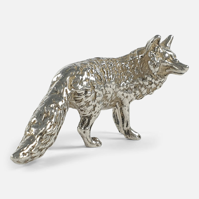 the fox viewed at a slight angle facing right