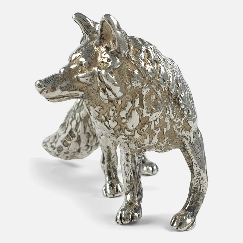the silver fox with face turned left looking into the distance