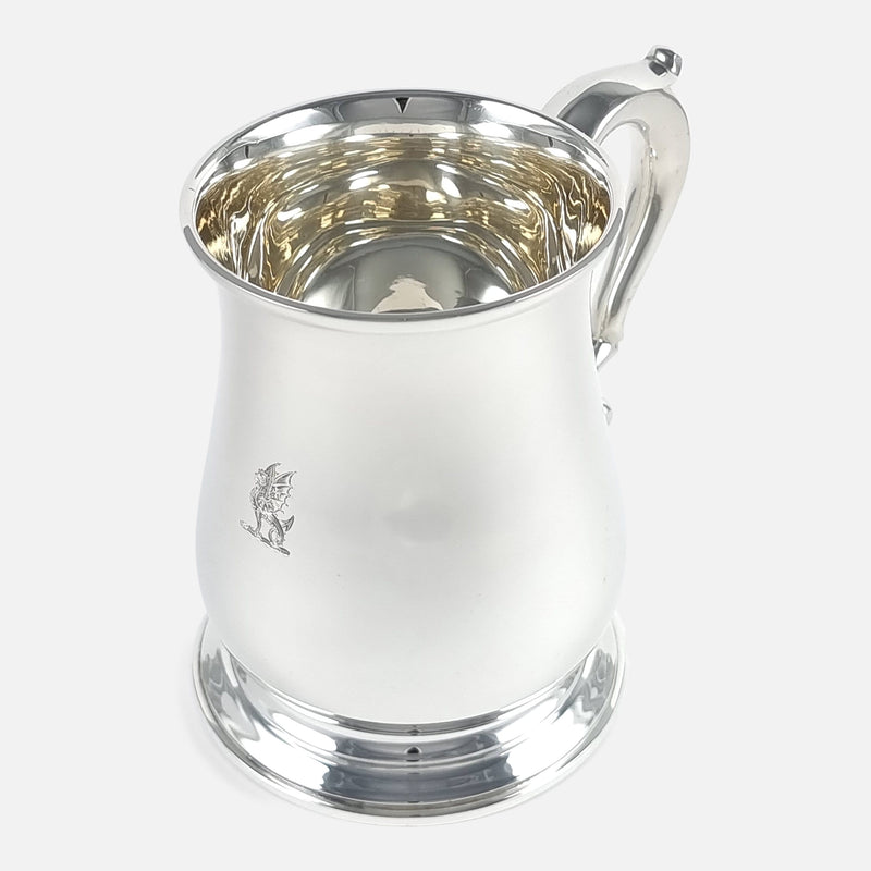 the mug with handle to the background pointing slightly towards the right