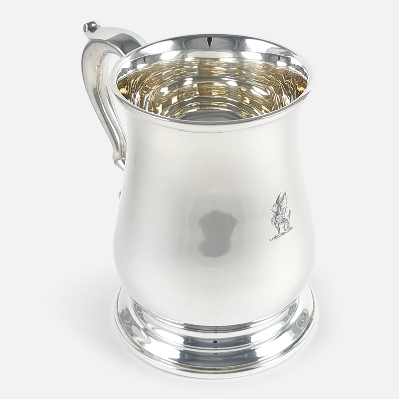the mug with handle to background pointing slightly towards the left