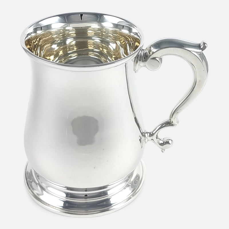 the mug viewed side on with the handle pointing right