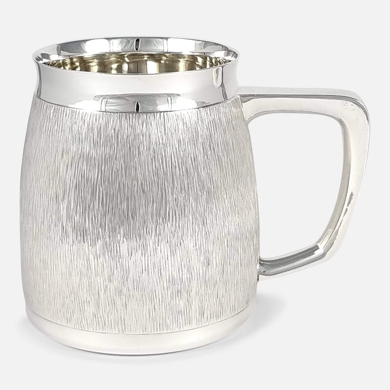 the sterling silver mug viewed side on with handle pointing right