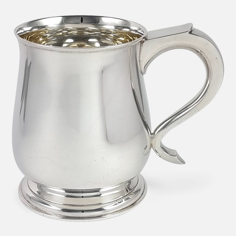 the silver mug viewed side on