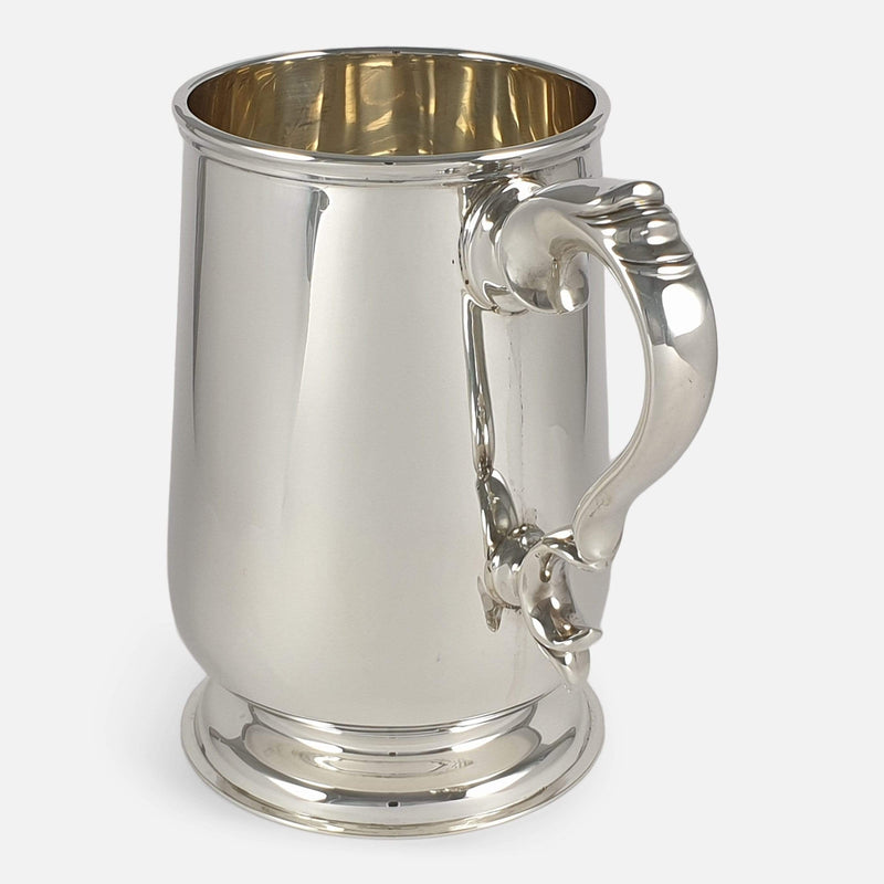 the tankard with handle angled towards the front