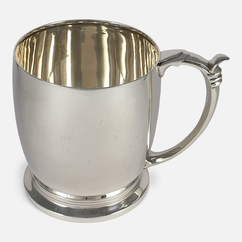 the sterling silver pint tankard to side with handle in view