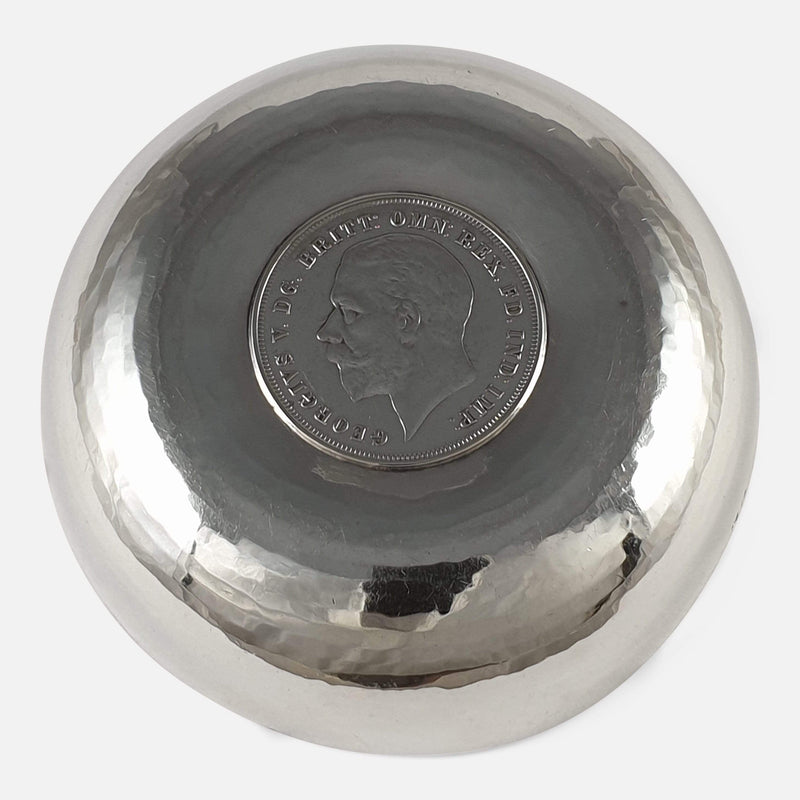 the bowl turned upside to reveal the coin
